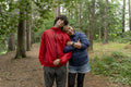 Portrait of mother and son hiking in forest