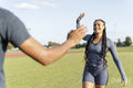 Couple of athletes doing high five
