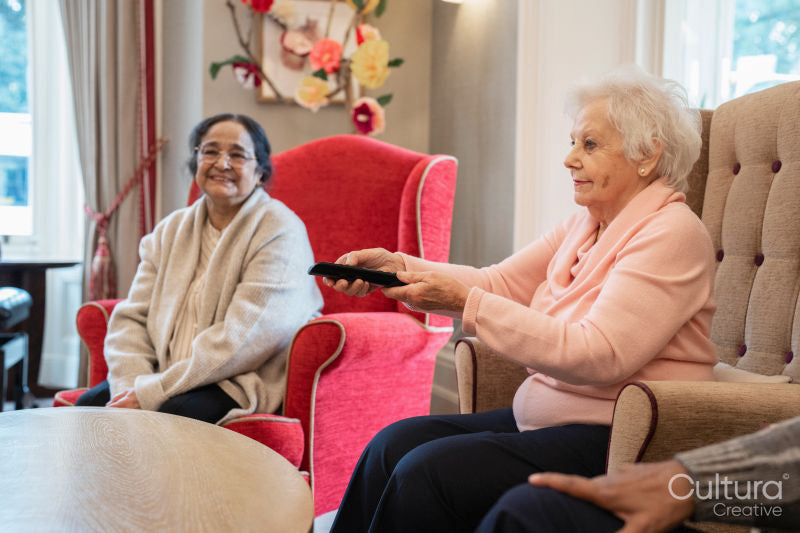 Senior people watching tv in nursing home