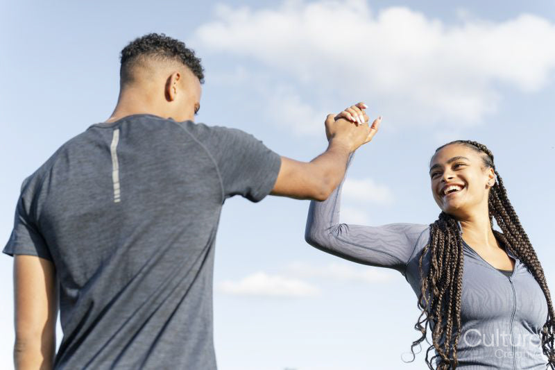 Couple of athletes doing high five