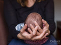 Close-up of woman holding baby son