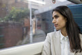 Businesswoman sitting in commuter train