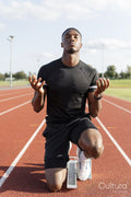 Athlete preparing to sprint at running track