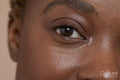 Close-up of smiling woman's eye