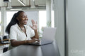 Businesswoman with laptop working in modern office