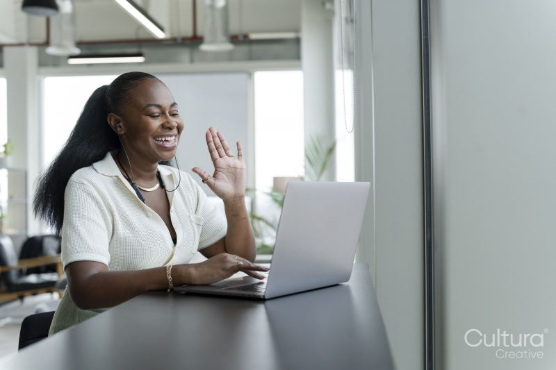 Businesswoman with laptop working in modern office
