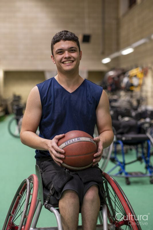 Portrait of smiling male basketball player in wheelchair