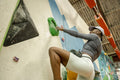 Woman on climbing wall