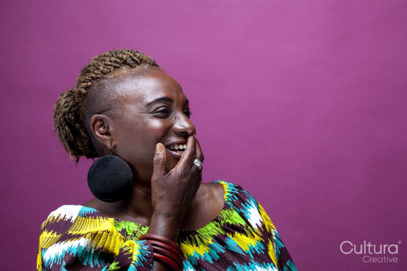 Studio shot of smiling woman