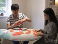 Couple preparing traditional Chinese decorations at home