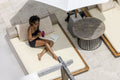 Smiling woman relaxing on poolside