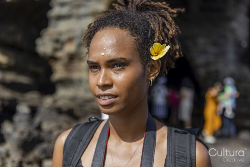 Portrait of woman with flower in hair