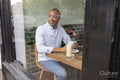 Man enjoying coffee at cafe table