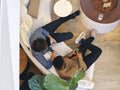 Overhead view of coworkers relaxing in office lobby