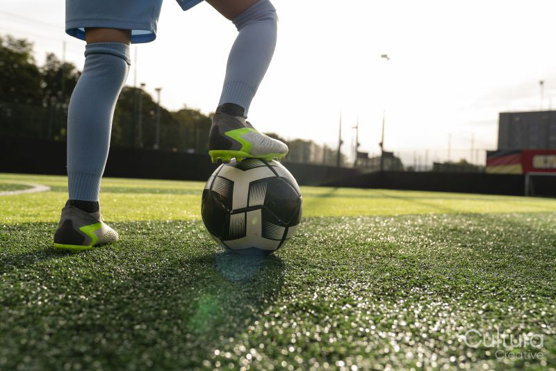 Low section of girl with soccer ball