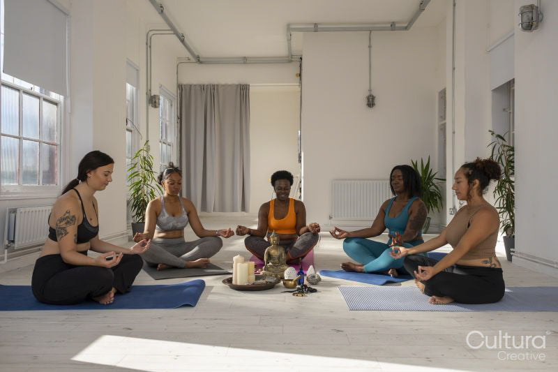 Women meditating in yoga studio