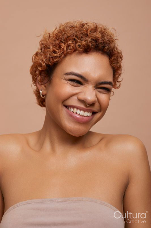 Studio portrait of happy non binary person