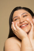 Studio portrait of smiling young woman