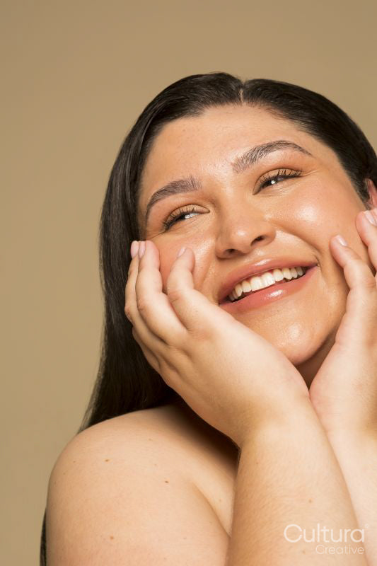 Studio portrait of smiling young woman