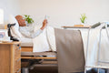 Senior man lying in adjustable bed in room at nursing home