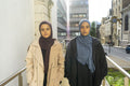 Two young women in street, portrait