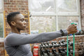 Athletic woman exercising with resistance band at gym
