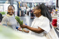 Young women grocery shopping together