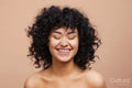 Studio portrait of beautiful laughing woman