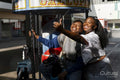 Young female friends taking selfie on merry-go-round