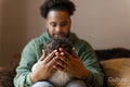 Father holding baby daughter at home