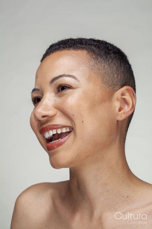 Studio portrait of smiling woman