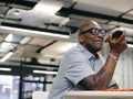 Man using phone in office space