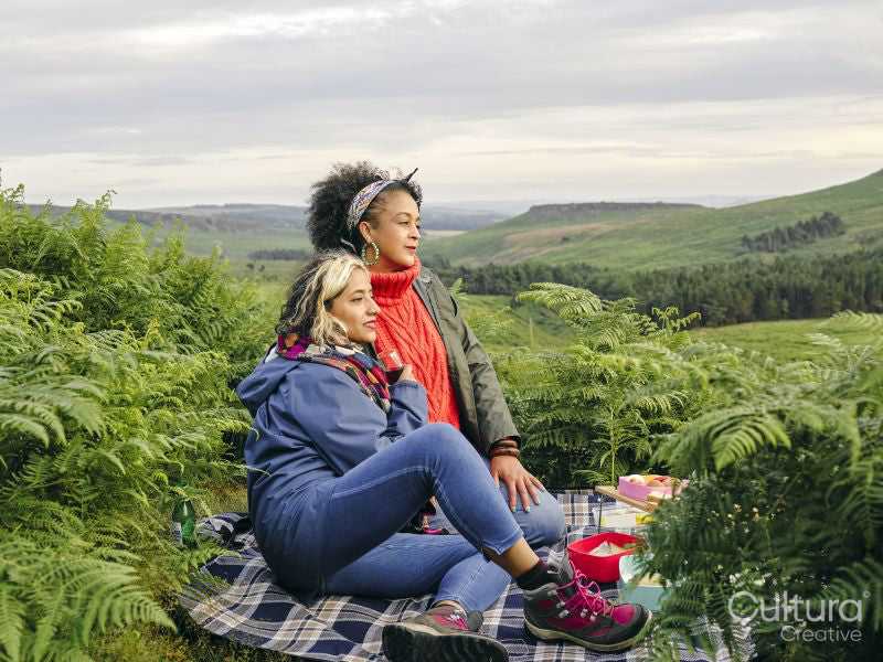 Female hikers having picnic