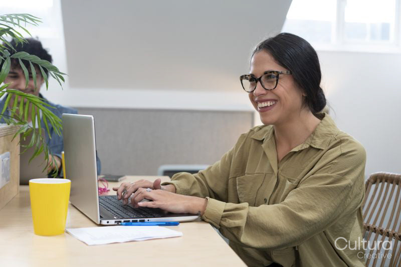 Smiling businesswoman working in office