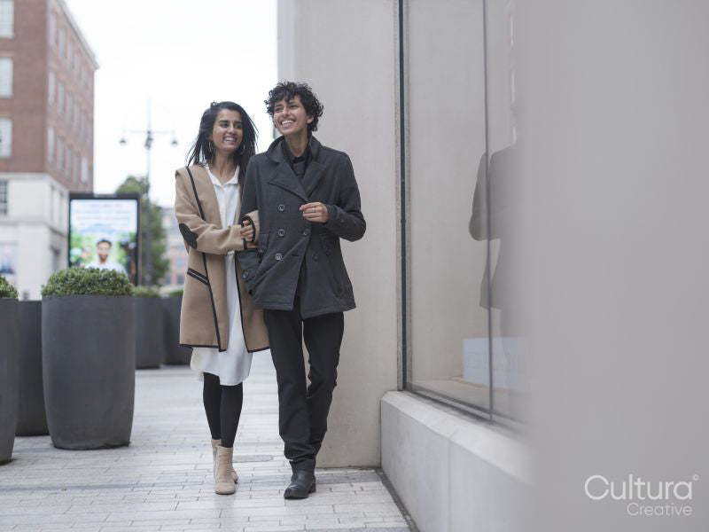 Female couple walking in street