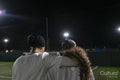 Female soccer players embracing