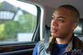 Man sitting in car with buckled seatbelt