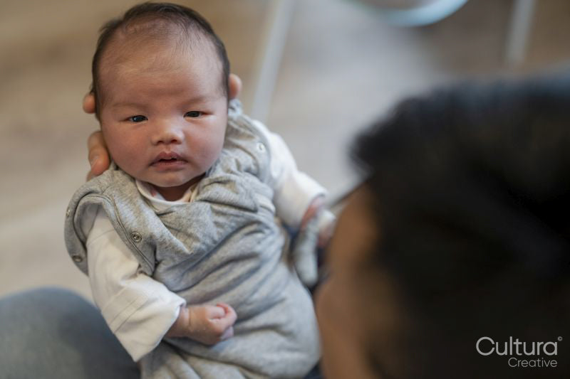 Father holding baby daughter