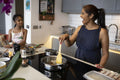 Mother and daughter cooking in kitchen