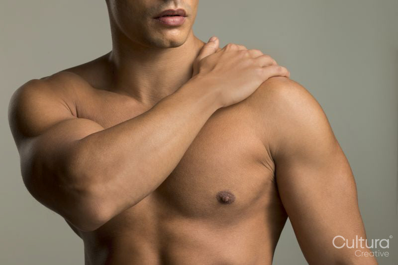 Mid section of shirtless muscular man