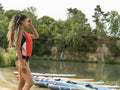 Woman looking at lake before paddleboarding