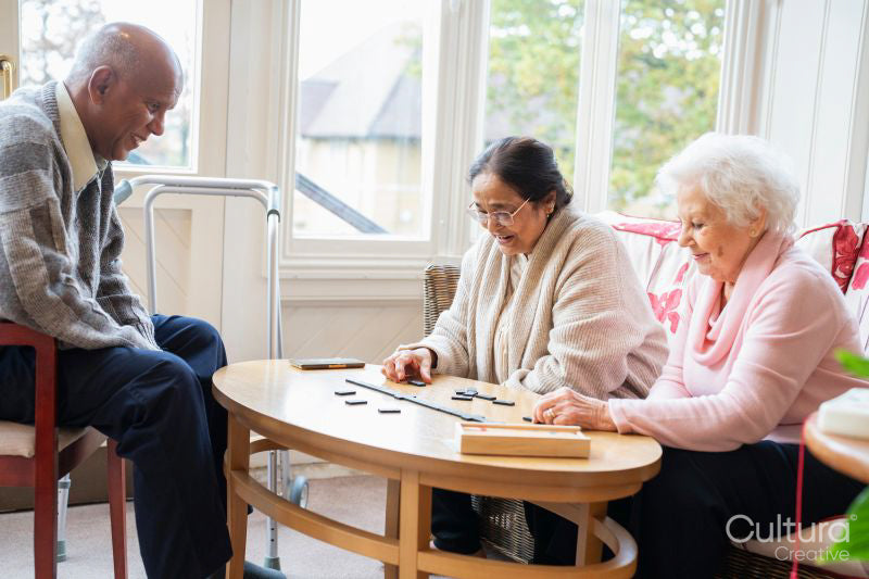 Senior people playing domino in nursing home