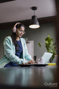 Female student using laptop while studying