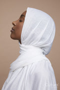 Studio shot of young woman wearing white hijab