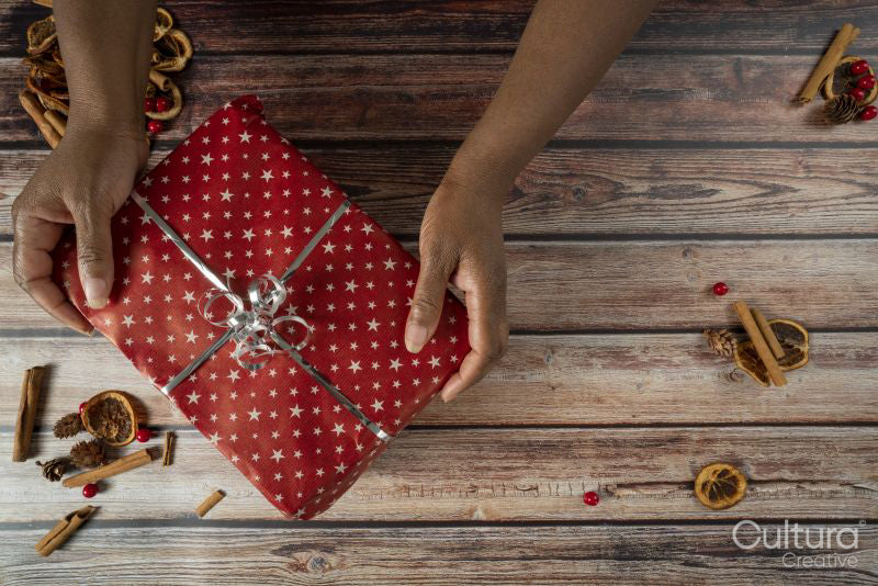 Woman holding Christmas gift