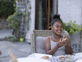 Smiling girl eating hamburger
