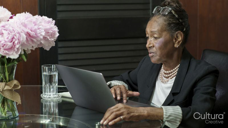 Senior woman using laptop