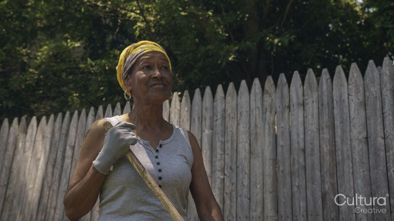 Senior woman working in backyard
