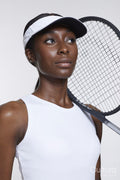 Studio portrait of athletic woman with tennis racket