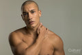 Studio portrait of serious shirtless man
